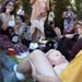  Baby and parent amusing themselves in the grass